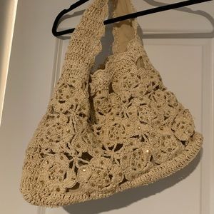 Cream woven purse with flower pattern